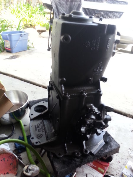 Transmission was stripped of old paint(bright orange), rust removed, and painted