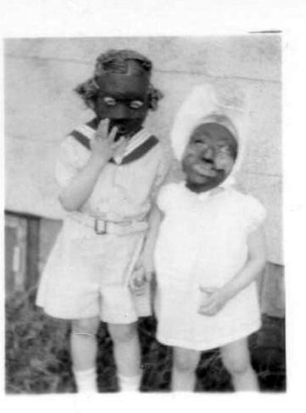 Me on the right, my sister on the left. 1946. Yes my mother has a dress on me. She must have watched the Al Jolson Story which came out that year.