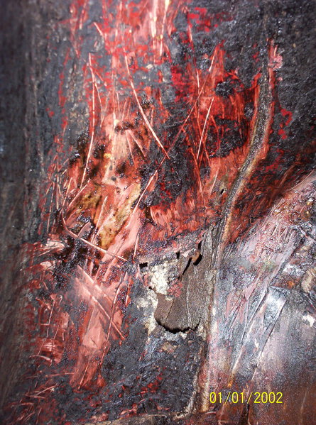 Another shot of rust hole in rt. rear fender well.  The asphalt-like undercoating seems to have protected everything else pretty good.  I am thinking this rust is from moisture that got in from above, but I don't know where that would be from.