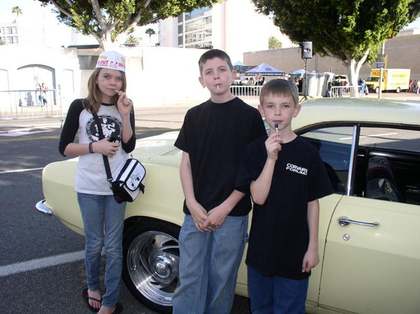 Car show entry $60.00. My kids posing for pictures next to my car, priceless. :)