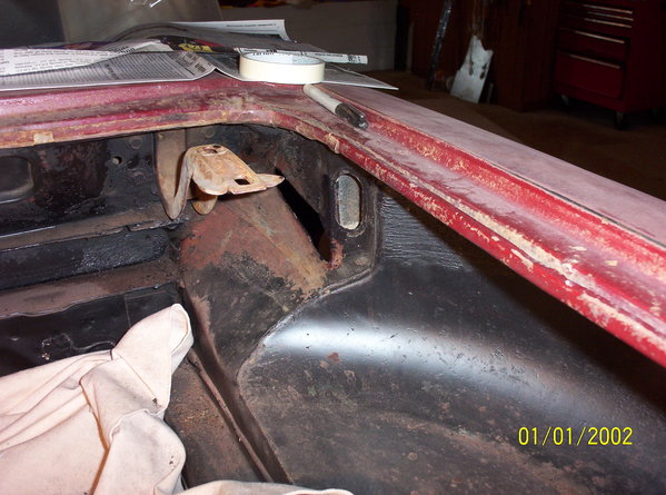 View of cut out in engine compartment