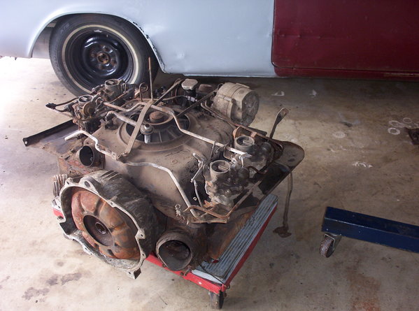 This is what I was starting with on the panel.  It is rusted at the wheel well and dented as well.  The motor is a future project and is just eye candy for now!