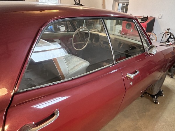 Passenger side glass installed and doors aligned.