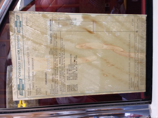 window sticker in LH rear.  I'm eventually going to replace window (with sticker attached) to preserve document.  The invoice price paid by dealer was 2070.71