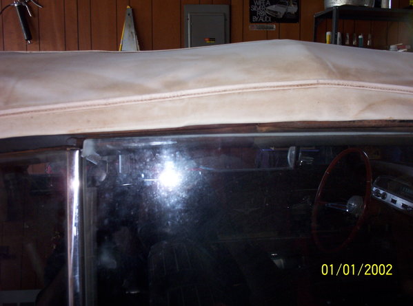 passenger side closer view:  The window is hitting higher on the weatherstrip rubber and it is holding the window outward some