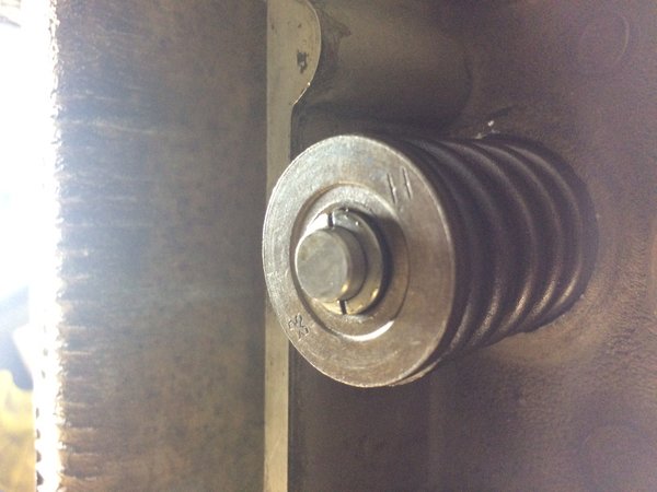 Intake valve showing wedges coming out of the top of spring cap surface