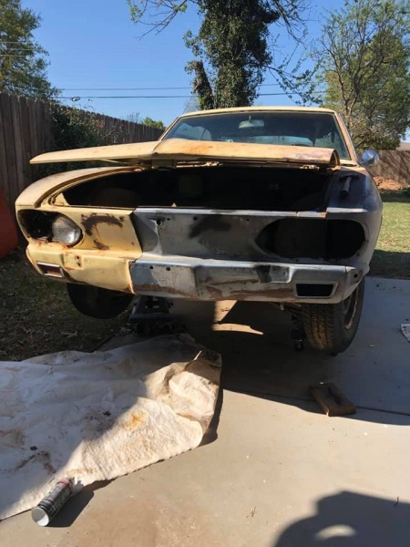 Up on modified harbor freight dollies, just to be able to roll it out of the way. &quot;Don't have a cow man&quot;! Jack stands are on the dollies with 2x4s across the dollies for added strength. NO I don't get under it. Just makes it easier to sit on a roll around stool and work on the front sheet metal!