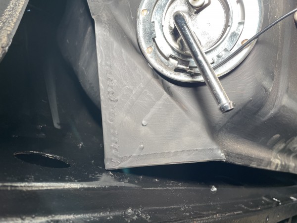 Tank as received with bent corner flanges.  Hits the car.