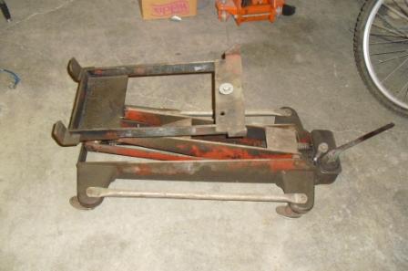 This is a 1960's Wudell 700 transmission jack with the factory GM engine cradle my father used when he worked at GM in the 60's