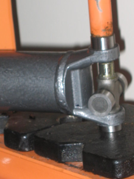 Remove the opposite cap and insert the U-joint into the set cap.  Do this very carefully as you do not want to upset any of the roller bearings and get them to fall into the end of the cap.