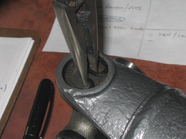 Press in far enough to be able to insert your new clip.  Flip the shaft and press in the other side to seat the U-joint against the clip.  Install the other new clip.  Repeat on other end of shaft.