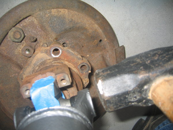 Once the U-Joints are in, it is a good idea to set them into there perspective sockets.  Take the shaft and insert into a yoke either on the car or a spare.  GENTLY give it a rap to set the cap against the clip.  Don't overdo it.  Just a tap is fine.  If a U-joint was binding a little, this will most likely loosen it up a touch.