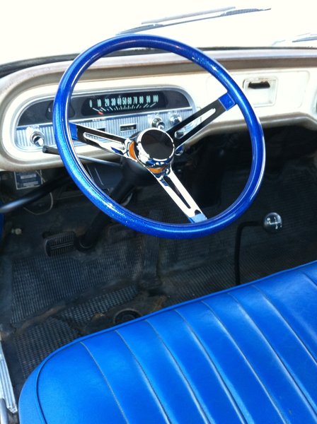 Old school blue vinyl flake steering wheel on newly painted column.